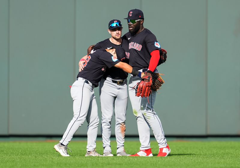 Sep 2, 2024; Kansas City, Missouri, USA; Cleveland Guardians left fielder Steven Kwan (38) and center fielder Lane Thomas (8) and right fielder Jhonkensy Noel (43) celebrate after defeating the Kansas City Royals at Kauffman Stadium. Mandatory Credit: Jay Biggerstaff-USA TODAY Sports