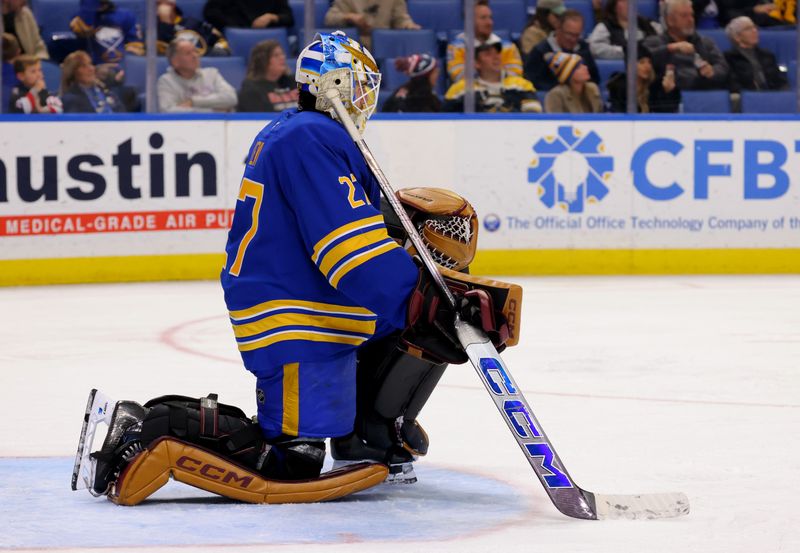 Nov 14, 2024; Buffalo, New York, USA;  Buffalo Sabres goaltender Devon Levi (27) during a stoppage in play against the St. Louis Blues during the third period at KeyBank Center. Mandatory Credit: Timothy T. Ludwig-Imagn Images