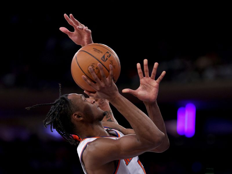 NEW YORK, NEW YORK - APRIL 09:  Immanuel Quickley #5 of the New York Knicks takes a shot under pressure in the second half against the Indiana Pacers at Madison Square Garden on April 09, 2023 in New York City. NOTE TO USER: User expressly acknowledges and agrees that, by downloading and or using this photograph, User is consenting to the terms and conditions of the Getty Images License Agreement. (Photo by Elsa/Getty Images)