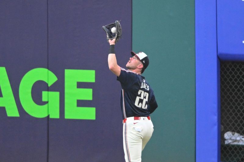 Jun 27, 2025; Cleveland, Ohio, USA; Cleveland Guardians right fielder Nolan Jones (22) catches a fly ball in the fourth inning against the St. Louis Cardinals at Progressive Field. Mandatory Credit: David Richard-Imagn Images