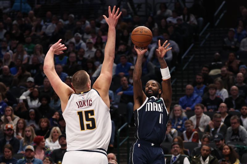 DALLAS, TEXAS - JANUARY 14: Kyrie Irving #11 of the Dallas Mavericks shoots against Nikola Jokic #15 of the Denver Nuggets during the third quarter at American Airlines Center on January 14, 2025 in Dallas, Texas. NOTE TO USER: User expressly acknowledges and agrees that, by downloading and/or using this photograph, user is consenting to the terms and conditions of the Getty Images License Agreement. (Photo by Sam Hodde/Getty Images)