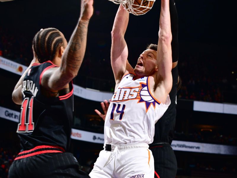 PHOENIX, AZ - JANUARY 22: Drew Eubanks #14 of the Phoenix Suns dunks the ball during the game against the Chicago Bulls on January 22, 2024 at Footprint Center in Phoenix, Arizona. NOTE TO USER: User expressly acknowledges and agrees that, by downloading and or using this photograph, user is consenting to the terms and conditions of the Getty Images License Agreement. Mandatory Copyright Notice: Copyright 2024 NBAE (Photo by Barry Gossage/NBAE via Getty Images)