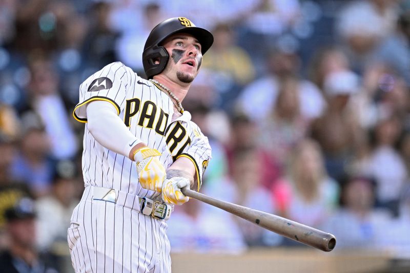 Aug 21, 2024; San Diego, California, USA; San Diego Padres center fielder Jackson Merrill (3) hits a two-run home run against the Minnesota Twins during the eighth inning at Petco Park. Mandatory Credit: Orlando Ramirez-USA TODAY Sports