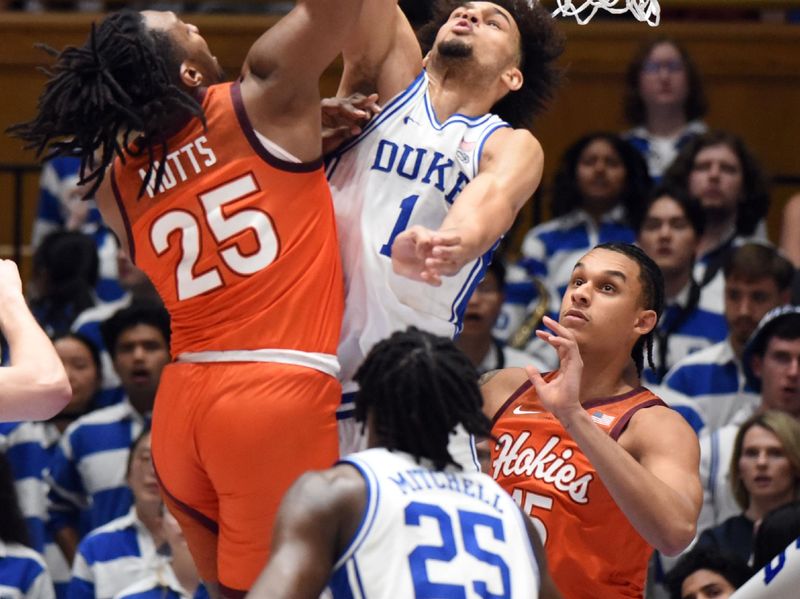 Feb 25, 2023; Durham, North Carolina, USA;  Duke Blue Devils center Dereck Lively (1) blocks the shot of Virginia Tech Hokies forward Justyn Mutts (25) during the second half at Cameron Indoor Stadium. The Blue Devils won 81-65. Mandatory Credit: Rob Kinnan-USA TODAY Sports