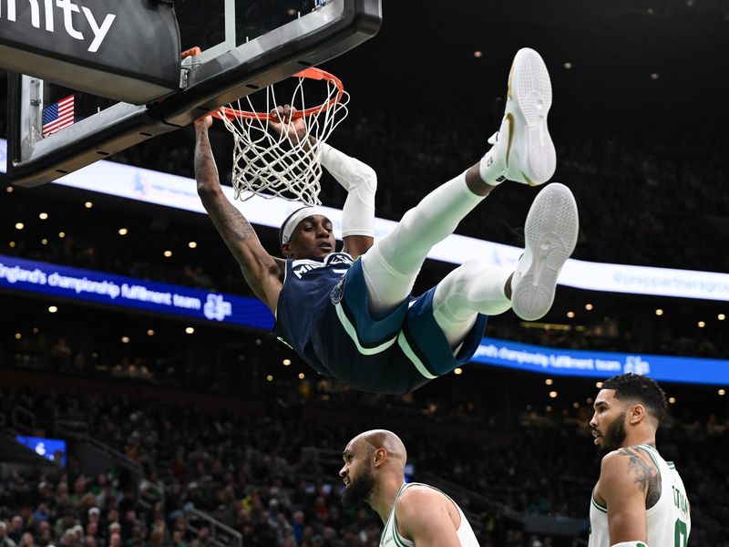 BOSTON, MASSACHUSETTS - NOVEMBER 24: Jaden McDaniels #3 of the Minnesota Timberwolves dunks and scores against the Boston Celtics during the fourth quarter at the TD Garden on November 24, 2024 in Boston, Massachusetts. NOTE TO USER: User expressly acknowledges and agrees that, by downloading and or using this photograph, User is consenting to the terms and conditions of the Getty Images License Agreement. (Photo by Brian Fluharty/Getty Images)