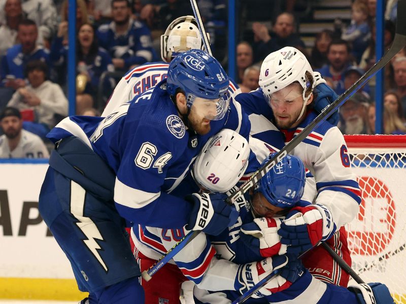 Mar 14, 2024; Tampa, Florida, USA; Tampa Bay Lightning defenseman Matt Dumba (24), New York Rangers left wing Chris Kreider (20) , Tampa Bay Lightning center Tyler Motte (64) and New York Rangers defenseman Zac Jones (6) fights during the third period at Amalie Arena. Mandatory Credit: Kim Klement Neitzel-USA TODAY Sports