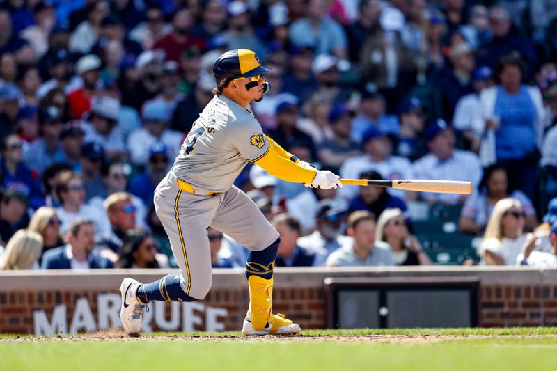 May 3, 2024; Chicago, Illinois, USA; Milwaukee Brewers catcher William Contreras (24) hits an RBI-single against the Chicago Cubs during the eight inning at Wrigley Field. Mandatory Credit: Kamil Krzaczynski-USA TODAY Sports