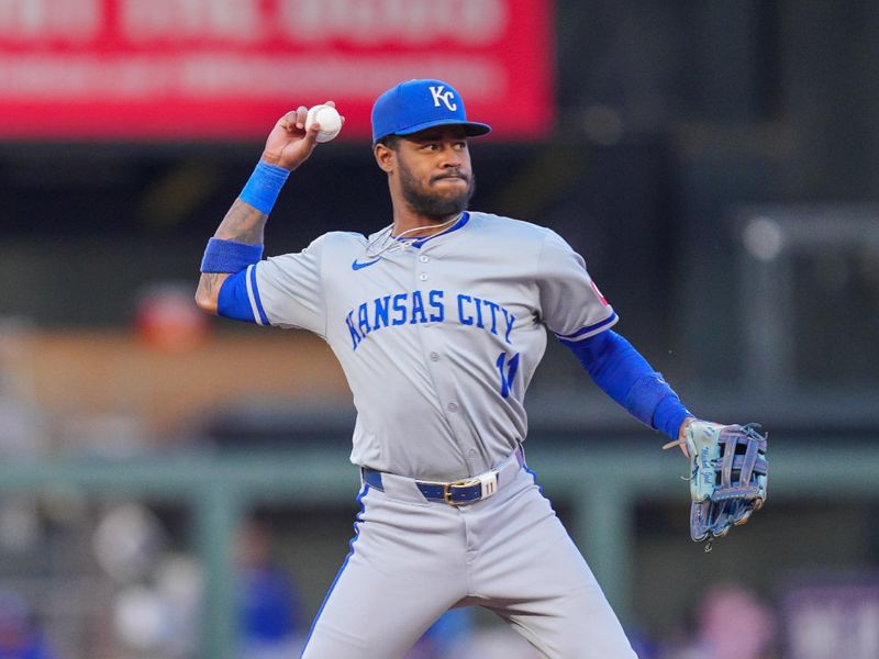 May 28, 2024; Minneapolis, Minnesota, USA; Kansas City Royals third base Maikel Garcia (11) throws to first base against the Minnesota Twins in the fifth inning at Target Field. Mandatory Credit: Brad Rempel-USA TODAY Sports