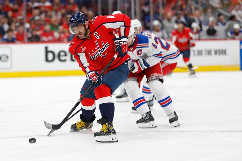 Apr 28, 2024; Washington, District of Columbia, USA; Washington Capitals left wing Alex Ovechkin (8) shoots the puck as New York Rangers defenseman Jacob Trouba (8) defends in the third period in game four of the first round of the 2024 Stanley Cup Playoffs at Capital One Arena. Mandatory Credit: Geoff Burke-USA TODAY Sports