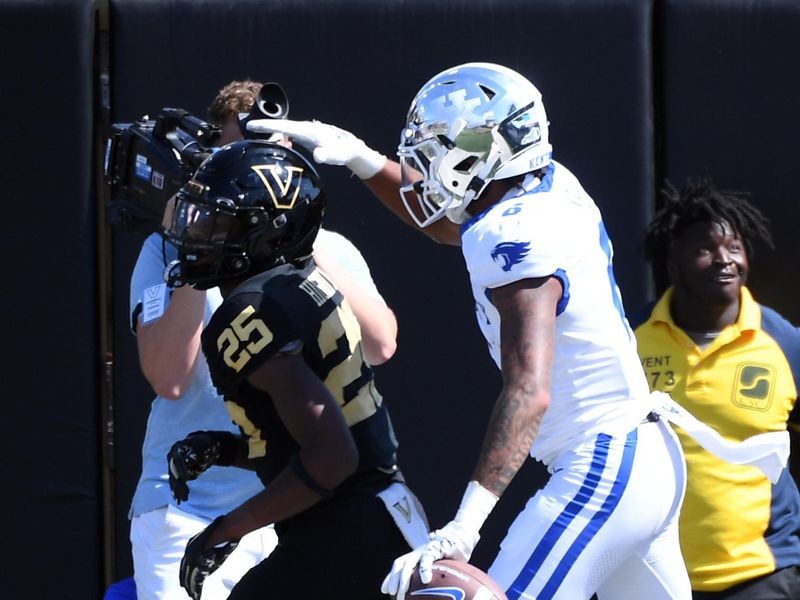 Sep 23, 2023; Nashville, Tennessee, USA; Kentucky Wildcats wide receiver Dane Key (6) pats the head of Vanderbilt Commodores cornerback Martel Hight (25) after a touchdown reception during the second half at FirstBank Stadium. Mandatory Credit: Christopher Hanewinckel-USA TODAY Sports