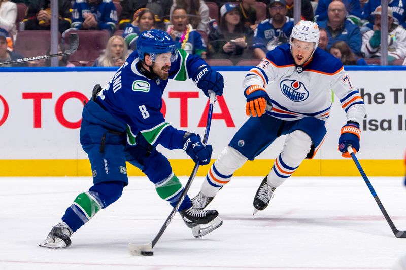 May 20, 2024; Vancouver, British Columbia, CAN; Edmonton Oilers defenseman Vincent Desharnais (73) watches as Vancouver Canucks forward Conor Garland (8) scores on this shot during the third period in game seven of the second round of the 2024 Stanley Cup Playoffs at Rogers Arena. Mandatory Credit: Bob Frid-USA TODAY Sports