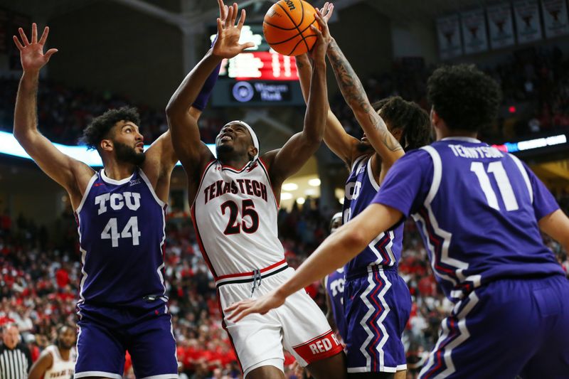 Feb 20, 2024; Lubbock, Texas, USA;  Texas Tech Red Raiders forward Robert Jennings (25) goes to the basket against TCU Horned Frogs forward Essay Mostafa (44) in the second half at United Supermarkets Arena. Mandatory Credit: Michael C. Johnson-USA TODAY Sports