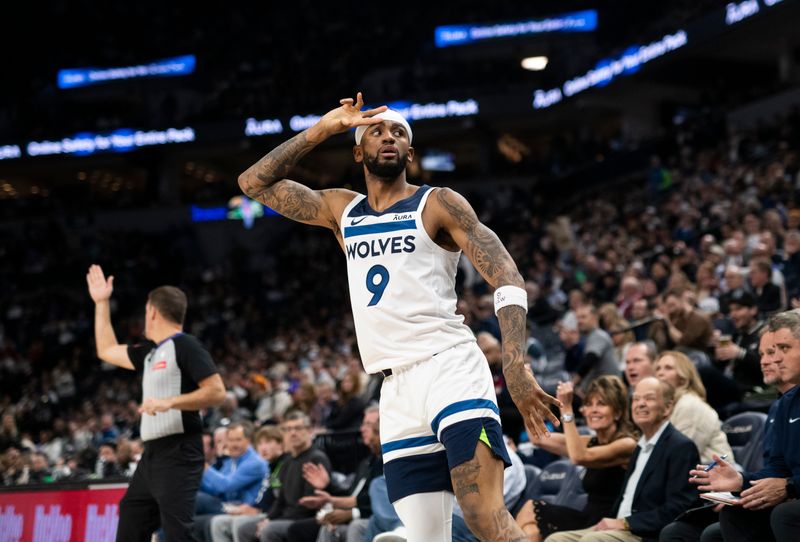 MINNEAPOLIS, MINNESOTA - APRIL 3: Nickeil Alexander-Walker #9 of the Minnesota Timberwolves celebrates after making a three point shot in the third quarter of the game against the Toronto Raptors at Target Center on April 3, 2024 in Minneapolis, Minnesota. NOTE TO USER: User expressly acknowledges and agrees that, by downloading and or using this photograph, User is consenting to the terms and conditions of the Getty Images License Agreement. (Photo by Stephen Maturen/Getty Images)