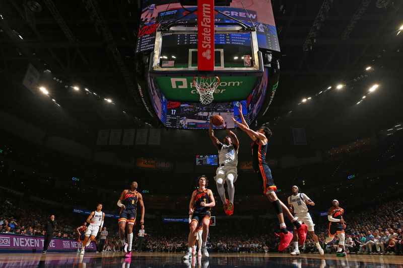 OKLAHOMA CITY, OK - APRIL 14:  Brandon Williams #00 of the Dallas Mavericks shoots the ball during the game against the Oklahoma City Thunder on April 14, 2024 at Paycom Arena in Oklahoma City, Oklahoma. NOTE TO USER: User expressly acknowledges and agrees that, by downloading and or using this photograph, User is consenting to the terms and conditions of the Getty Images License Agreement. Mandatory Copyright Notice: Copyright 2024 NBAE (Photo by Zach Beeker/NBAE via Getty Images)