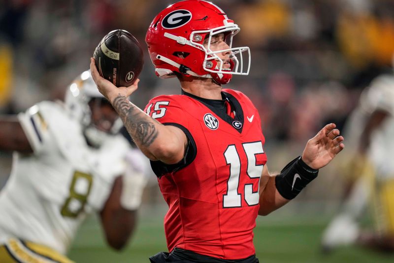 Nov 25, 2023; Atlanta, Georgia, USA; Georgia Bulldogs quarterback Carson Beck (15) passes the ball against the Georgia Tech Yellow Jackets during the first quarter at Hyundai Field. Mandatory Credit: Dale Zanine-USA TODAY Sports