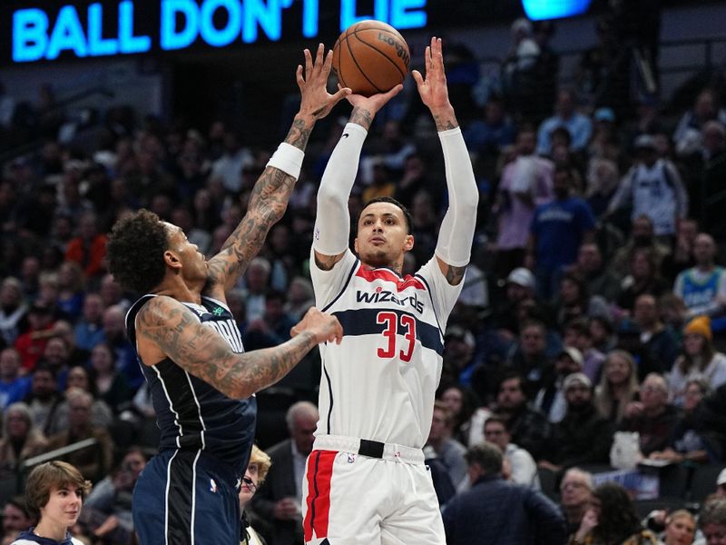 DALLAS, TX - FEBRUARY 12: Kyle Kuzma #33 of the Washington Wizards shoots a three point basket during the game against the Dallas Mavericks on February 12, 2024 at the American Airlines Center in Dallas, Texas. NOTE TO USER: User expressly acknowledges and agrees that, by downloading and or using this photograph, User is consenting to the terms and conditions of the Getty Images License Agreement. Mandatory Copyright Notice: Copyright 2024 NBAE (Photo by Glenn James/NBAE via Getty Images)