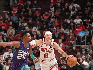 CHICAGO, IL - DECEMBER 6: Alex Caruso #6 of the Chicago Bulls dribbles the ball during the game against the Charlotte Hornets on December 6, 2023 at the United Center in Chicago, Illinois. NOTE TO USER: User expressly acknowledges and agrees that, by downloading and or using this Photograph, user is consenting to the terms and conditions of the Getty Images License Agreement. Mandatory Copyright Notice: Copyright 2023 NBAE (Photo by Gary Dineen/NBAE via Getty Images).