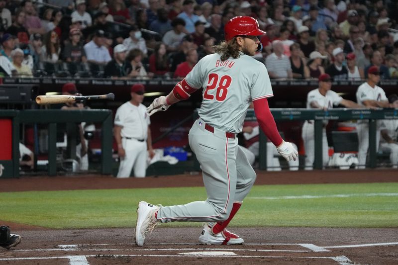 Aug 11, 2024; Phoenix, Arizona, USA; Philadelphia Phillies third base Alec Bohm (28) hits a two run double against the Arizona Diamondbacks in the first inning at Chase Field. Mandatory Credit: Rick Scuteri-USA TODAY Sports