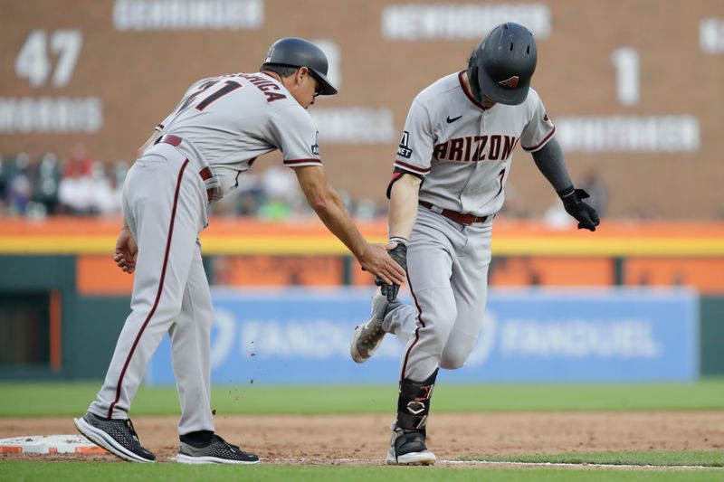 Jun 9, 2023; Detroit, Michigan, USA; Arizona Diamondbacks outfielder Corbin Carroll runs the bases after a home run and high-fives third base coach Tony Perezchica during the game against the Detroit Tigers at Comerica Park. Mandatory Credit: Brian Bradshaw Sevald-USA TODAY Sports