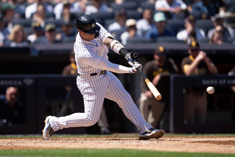 May 28, 2023; Bronx, New York, USA; New York Yankees second baseman Gleybor Torres (25) hits a single against the San Diego Padres during the third inning at Yankee Stadium. Mandatory Credit: Gregory Fisher-USA TODAY Sports