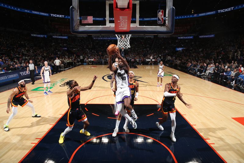 OKLAHOMA CITY, OK - FEBRUARY 11: Harrison Barnes #40 of the Sacramento Kings drives to the basket during the game against the Oklahoma City Thunder on February 11, 2024 at Paycom Arena in Oklahoma City, Oklahoma. NOTE TO USER: User expressly acknowledges and agrees that, by downloading and or using this photograph, User is consenting to the terms and conditions of the Getty Images License Agreement. Mandatory Copyright Notice: Copyright 2024 NBAE (Photo by Zach Beeker/NBAE via Getty Images)