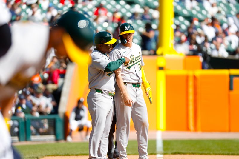 Apr 7, 2024; Detroit, Michigan, USA; Oakland Athletics outfielder JJ Bleday (33) talks with Oakland Athletics third base coach Eric Martins (3) during the game against the Detroit Tigers at Comerica Park. Mandatory Credit: Brian Bradshaw Sevald-USA TODAY Sports