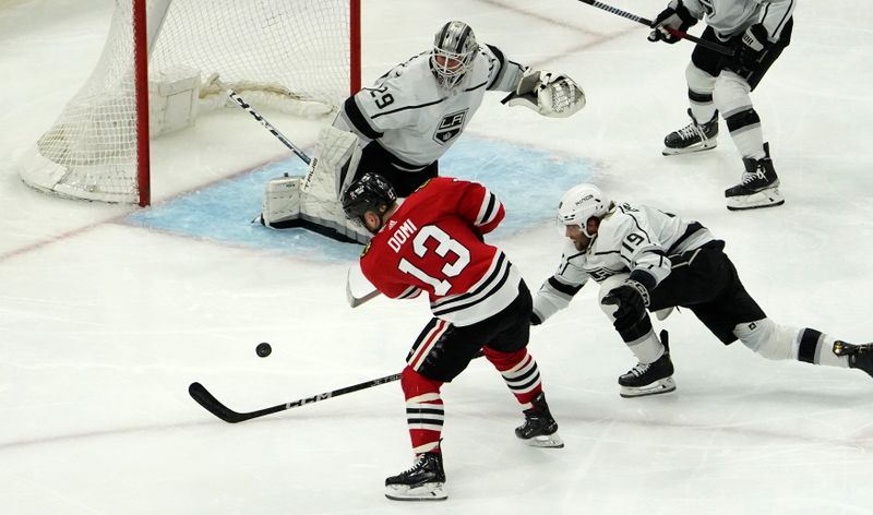 Jan 22, 2023; Chicago, Illinois, USA; Chicago Blackhawks center Max Domi (13) shoots the puck on Los Angeles Kings goaltender Pheonix Copley (29) during the third period at United Center. Mandatory Credit: David Banks-USA TODAY Sports