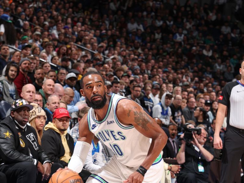 MINNEAPOLIS, MN -  FEBRUARY 23: Mike Conley #10 of the Minnesota Timberwolves goes to the basket during the game on February 23, 2024 at Target Center in Minneapolis, Minnesota. NOTE TO USER: User expressly acknowledges and agrees that, by downloading and or using this Photograph, user is consenting to the terms and conditions of the Getty Images License Agreement. Mandatory Copyright Notice: Copyright 2024 NBAE (Photo by David Sherman/NBAE via Getty Images)