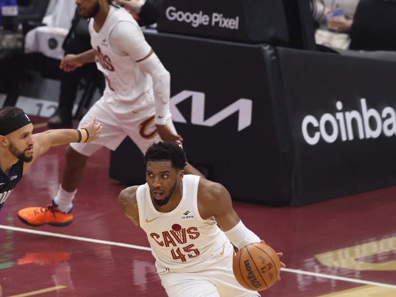 CLEVELAND, OH - APRIL 22: Donovan Mitchell #45 of the Cleveland Cavaliers dribbles the ball during the game against the Orlando Magic during Round 1 Game 2 of the 2024 NBA Playoffs on April 22, 2024 at Rocket Mortgage FieldHouse in Cleveland, Ohio. NOTE TO USER: User expressly acknowledges and agrees that, by downloading and/or using this Photograph, user is consenting to the terms and conditions of the Getty Images License Agreement. Mandatory Copyright Notice: Copyright 2024 NBAE (Photo by Lauren Leigh Bacho/NBAE via Getty Images)