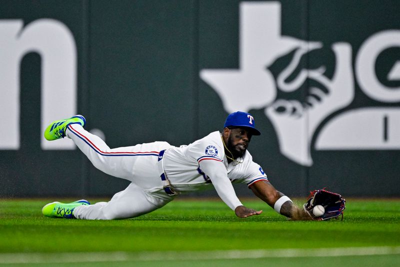 Sep 5, 2024; Arlington, Texas, USA; Texas Rangers right fielder Adolis Garcia (53) leaps but cannot catch a fly ball hit by Los Angeles Angels designated hitter Brandon Drury (not pictured) during the seventh inning at Globe Life Field. Mandatory Credit: Jerome Miron-Imagn Images