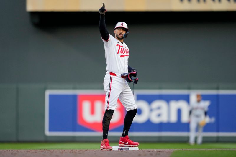 Apr 4, 2024; Minneapolis, Minnesota, USA; Minnesota Twins shortstop Carlos Correa (4) reacts after hitting a double during the eighth inning against the Cleveland Guardians at Target Field. Mandatory Credit: Jordan Johnson-USA TODAY Sports