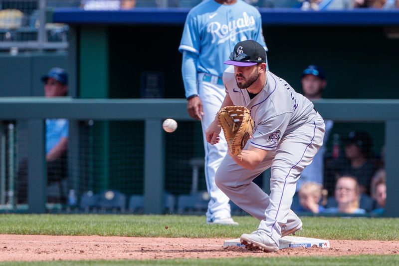 Jun 4, 2023; Kansas City, Missouri, USA; Colorado Rockies first baseman Mike Moustakas (11) reaches for a throw during the eighth inning against the Kansas City Royals  at Kauffman Stadium. Mandatory Credit: William Purnell-USA TODAY Sports
