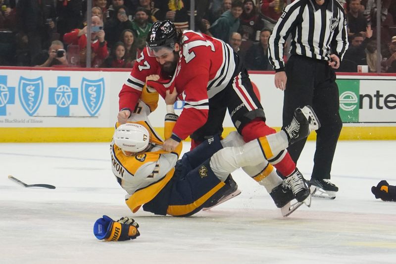 Oct 25, 2024; Chicago, Illinois, USA; Chicago Blackhawks left wing Patrick Maroon (77) and Nashville Predators right wing Michael McCarron (47) fight during the first period at the United Center. Mandatory Credit: David Banks-Imagn Images