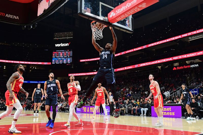 ATLANTA, GA - FEBRUARY 25: Wendell Carter Jr. #34 of the Orlando Magic dunks the ball during the game against the Atlanta Hawks on February 25, 2024 at State Farm Arena in Atlanta, Georgia.  NOTE TO USER: User expressly acknowledges and agrees that, by downloading and/or using this Photograph, user is consenting to the terms and conditions of the Getty Images License Agreement. Mandatory Copyright Notice: Copyright 2024 NBAE (Photo by Scott Cunningham/NBAE via Getty Images)