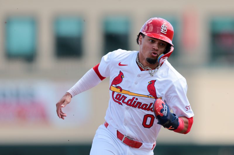 Mar 15, 2025; Jupiter, Florida, USA; St. Louis Cardinals shortstop Masyn Winn (0) runs toward third base against the Toronto Blue Jays during the first inning at Roger Dean Chevrolet Stadium. Mandatory Credit: Sam Navarro-Imagn Images