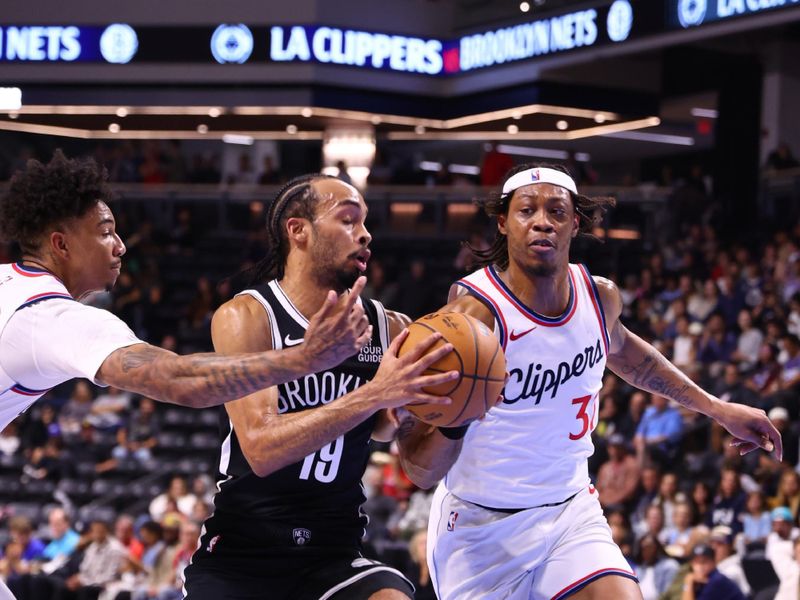 OCEANSIDE, CALIFORNIA - OCTOBER 08: Amari Bailey #10 of the Brooklyn Nets drives the lane against Alondes Williams #15 of the Los Angeles Clippers in the fourth quarter at Frontwave Arena on October 08, 2024 in Oceanside, California. NOTE TO USER: User expressly acknowledges and agrees that, by downloading and or using this photograph, User is consenting to the terms and conditions of the Getty Images License Agreement. (Photo by Joe Scarnici/Getty Images)