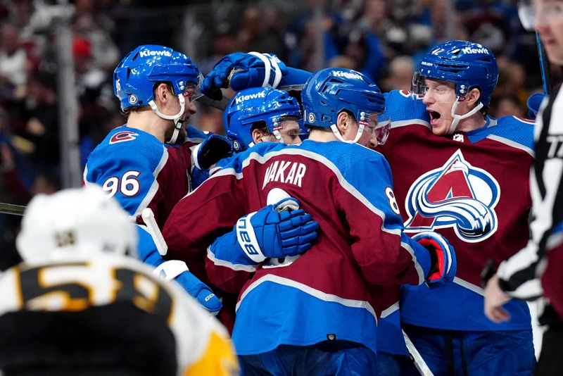 Mar 24, 2024; Denver, Colorado, USA; Colorado Avalanche left wing Jonathan Drouin (27) (center) celebrates his overtime winning goal with right wing Mikko Rantanen (96) and defenseman Cale Makar (8) defenseman Josh Manson (42) in third period at Ball Arena. Mandatory Credit: Ron Chenoy-USA TODAY Sports