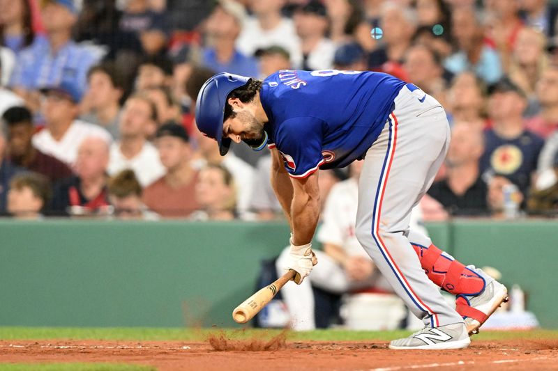 oAug 14, 2024; Boston, Massachusetts, USA; Texas Rangers third base Josh Smith (8) hits the dirt with his bat after hitting a fly out against the Boston Red Sox during the seventh inning at Fenway Park. Mandatory Credit: Brian Fluharty-USA TODAY Sports