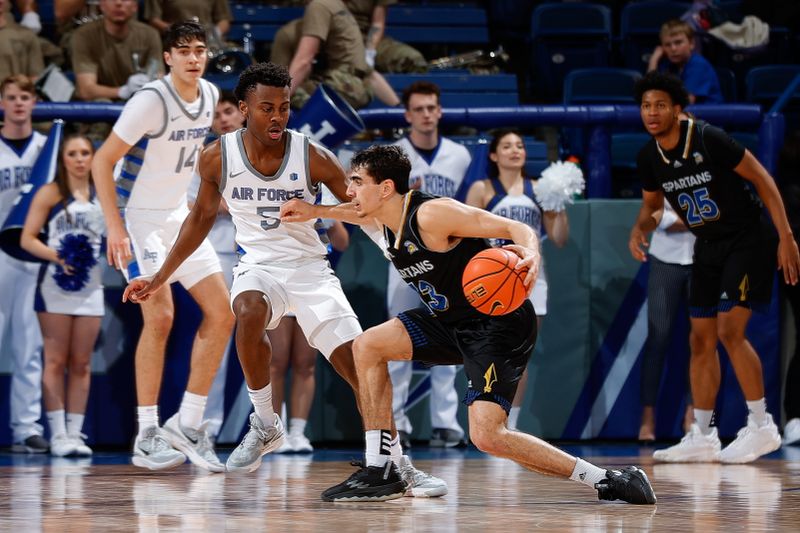 Mar 4, 2023; Colorado Springs, Colorado, USA; San Jose State Spartans guard Alvaro Cardenas (13) controls the ball as Air Force Falcons guard Ethan Taylor (5) guards in the second half at Clune Arena. Mandatory Credit: Isaiah J. Downing-USA TODAY Sports