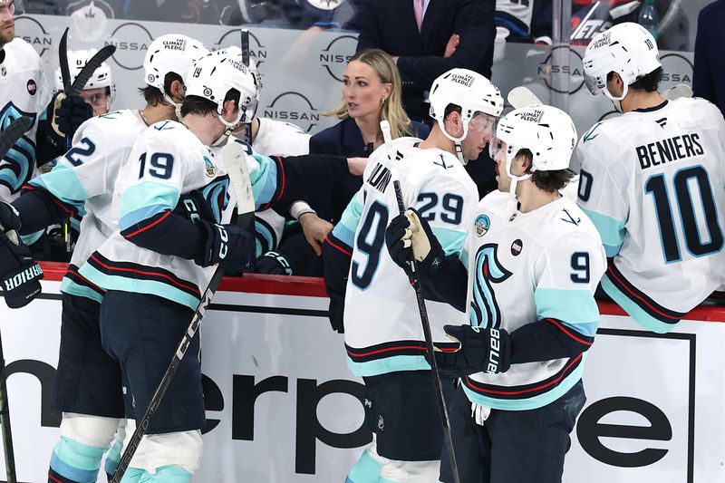 Jan 16, 2025; Winnipeg, Manitoba, CAN; Seattle Kraken assistant coach Jessica Campbell discusses a play during a time out against the Winnipeg Jets in the third period at Canada Life Centre. Mandatory Credit: James Carey Lauder-Imagn Images