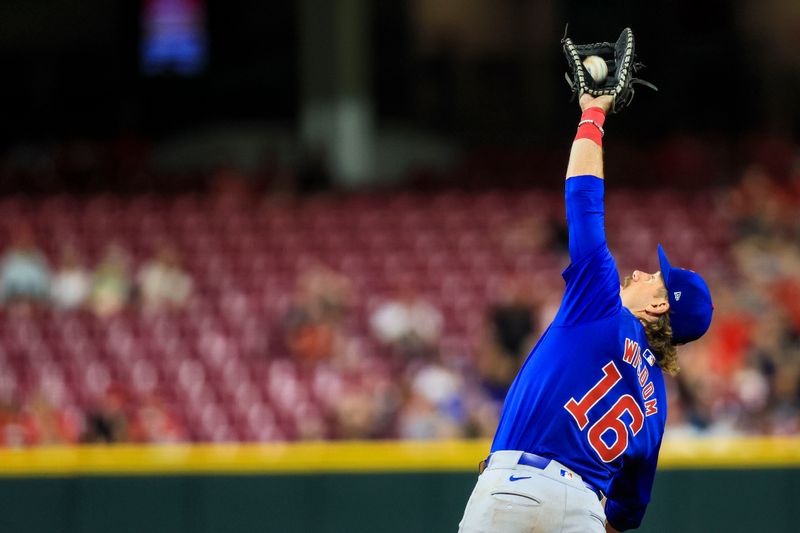 Jul 31, 2024; Cincinnati, Ohio, USA; Chicago Cubs first baseman Patrick Wisdom (16) catches a pop up hit by Cincinnati Reds first baseman Ty France (not pictured) in the eighth inning at Great American Ball Park. Mandatory Credit: Katie Stratman-USA TODAY Sports