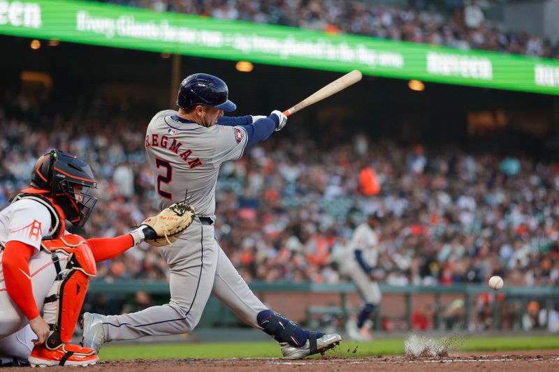 Jun 11, 2024; San Francisco, California, USA; Houston Astros third baseman Alex Bregman (2) singles on a ground ball during the fifth inning against the San Francisco Giants at Oracle Park. Mandatory Credit: Sergio Estrada-USA TODAY Sports