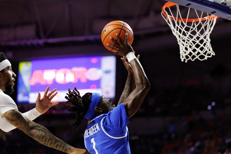 Feb 14, 2026; Gainesville, Florida, USA; Florida Gators guard Xaivian Lee (1) shoots the ball over Florida Gators guard Boogie Fland (0) during the first half at Exactech Arena at the Stephen C. O'Connell Center. Mandatory Credit: Matt Pendleton-Imagn Images