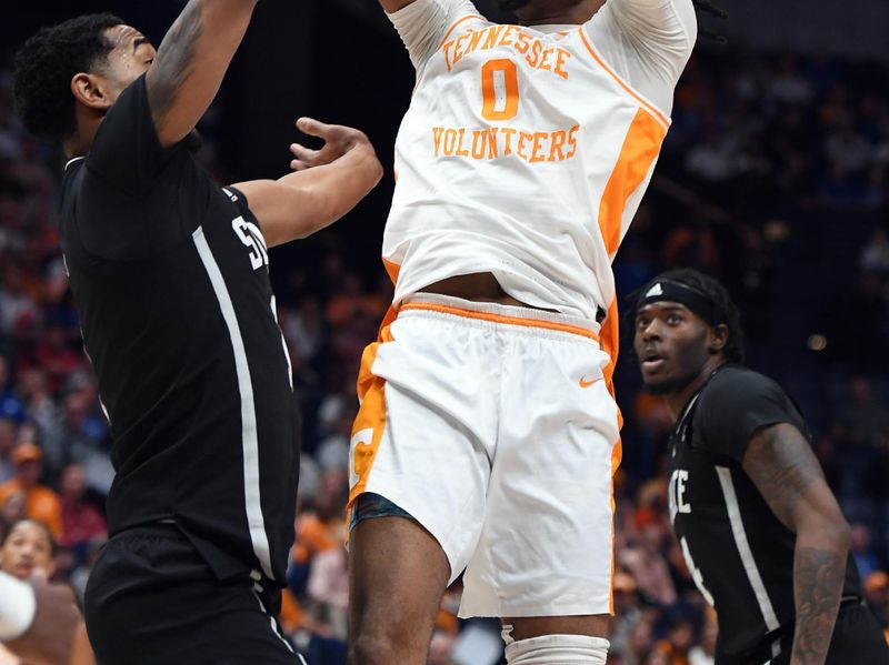 Mar 15, 2024; Nashville, TN, USA; Tennessee Volunteers forward Jonas Aidoo (0) attempts a shot during the first half against Mississippi State Bulldogs forward Tolu Smith (1) at Bridgestone Arena. Mandatory Credit: Christopher Hanewinckel-USA TODAY Sports