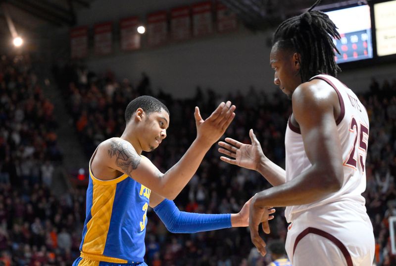 Feb 18, 2023; Blacksburg, Virginia, USA;  Virginia Tech Hokies forward Justyn Mutts (25) and Pittsburgh Panthers guard Greg Elliott (3) meet after a game at Cassell Coliseum. Mandatory Credit: Lee Luther Jr.-USA TODAY Sports