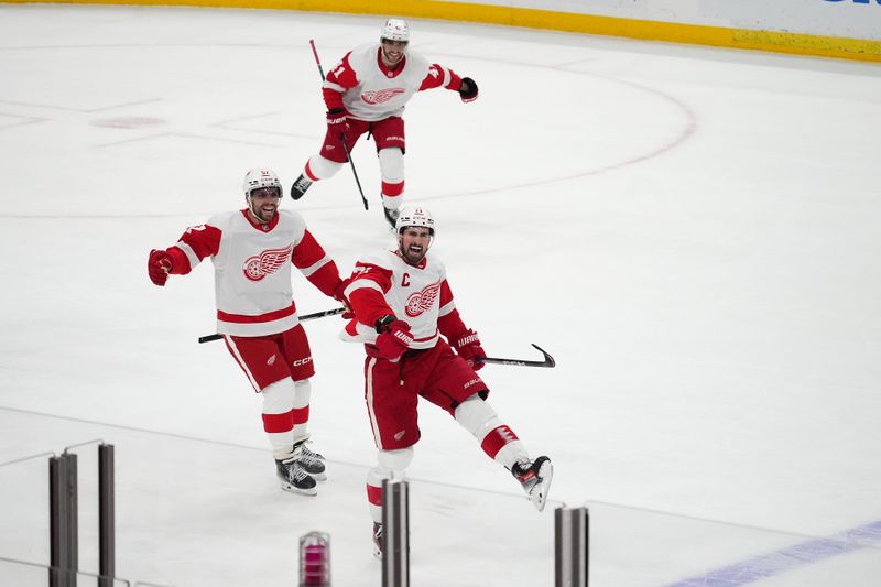 Jan 17, 2024; Sunrise, Florida, USA; Detroit Red Wings center Dylan Larkin (71) celebrates after scoring the game winning goal in overtime against the Florida Panthers at Amerant Bank Arena. Mandatory Credit: Jasen Vinlove-USA TODAY Sports