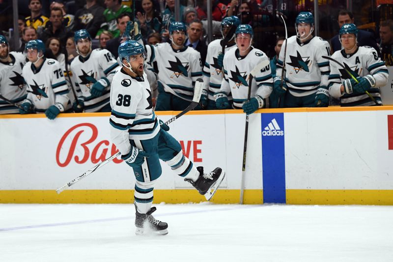 Mar 19, 2024; Nashville, Tennessee, USA; San Jose Sharks defenseman Mario Ferraro (38) celebrates after a goal during the second period against the Nashville Predators at Bridgestone Arena. Mandatory Credit: Christopher Hanewinckel-USA TODAY Sports