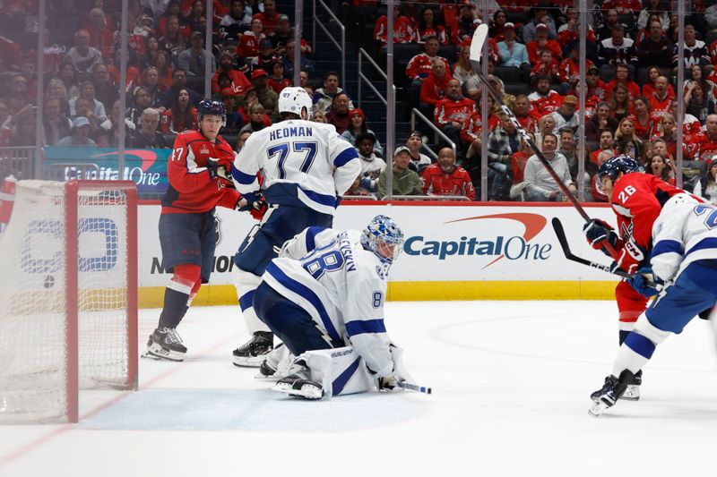 Apr 13, 2024; Washington, District of Columbia, USA; Washington Capitals center Nic Dowd (26) scores a goal on Tampa Bay Lightning goaltender Andrei Vasilevskiy (88) in the third period at Capital One Arena. Mandatory Credit: Geoff Burke-USA TODAY Sports