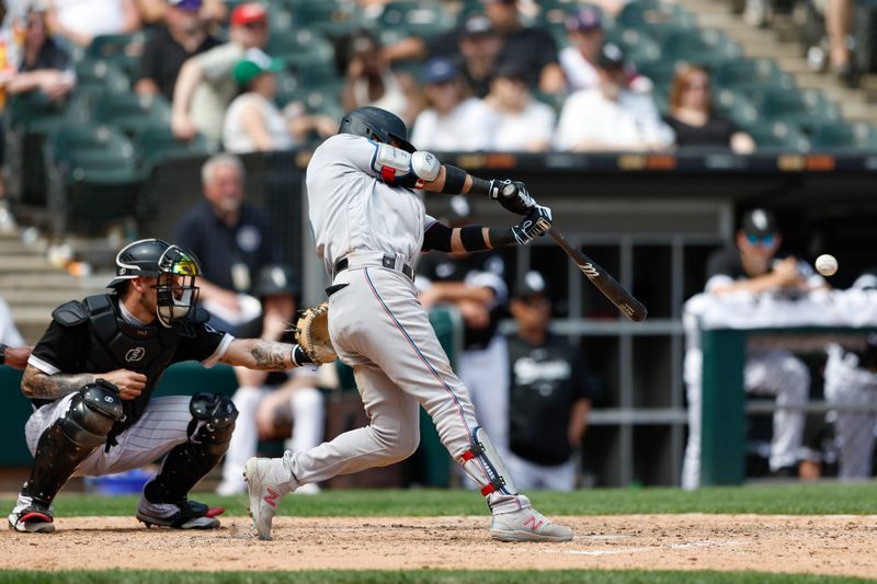 Jun 10, 2023; Chicago, Illinois, USA; Miami Marlins second baseman Luis Arraez (3) singles against the Chicago White Sox during the ninth inning at Guaranteed Rate Field. Mandatory Credit: Kamil Krzaczynski-USA TODAY Sports