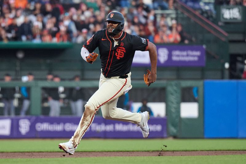 Aug 31, 2024; San Francisco, California, USA; San Francisco Giants outfielder Jerar Encarnacion (59) runs to third base against the Miami Marlins during the fifth inning at Oracle Park. Mandatory Credit: Robert Edwards-USA TODAY Sports